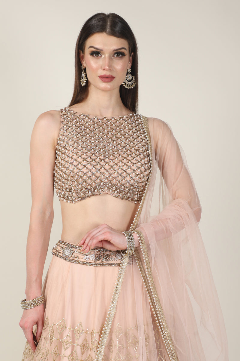 PEACH PEARL TOP WITH GOLDEN ZARI SKIRT