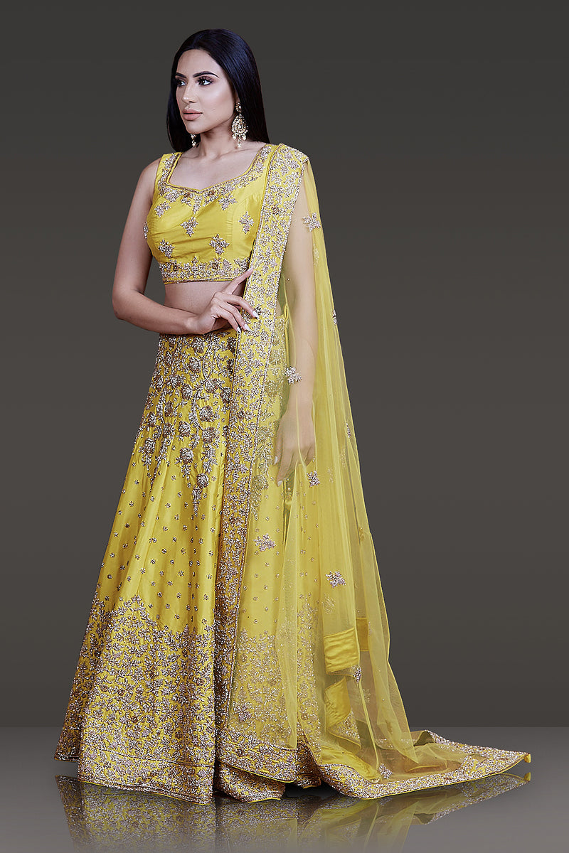 Bright Yellow Taffeta Silk Lehenga-Top-Dupatta Embossed with Ivory Gold & Stone Work