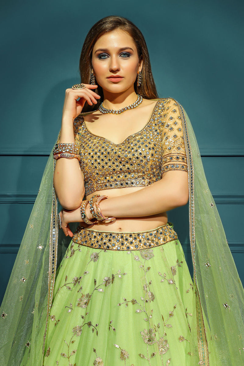 Golden blouse with green skirt