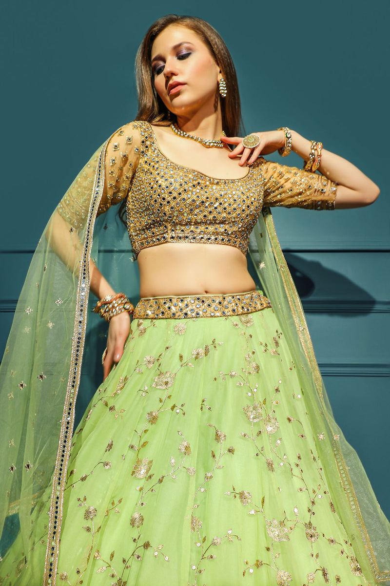 Golden blouse with green skirt