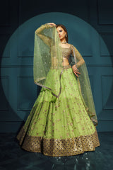 Golden blouse with green skirt