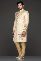 Ivory Gold Brocade Sherwani With Gold Dabka Embroidery Paired With Gold Chudidar